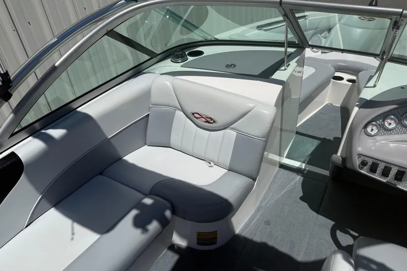 Slide: The Image of 2003 MasterCraft X2 boat interior with gray seating and dashboard controls. - 12