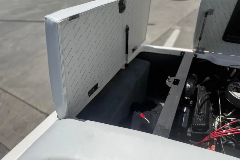 Slide: The Image of Open engine compartment of a 2003 MasterCraft X2 boat, showing interior details. - 17