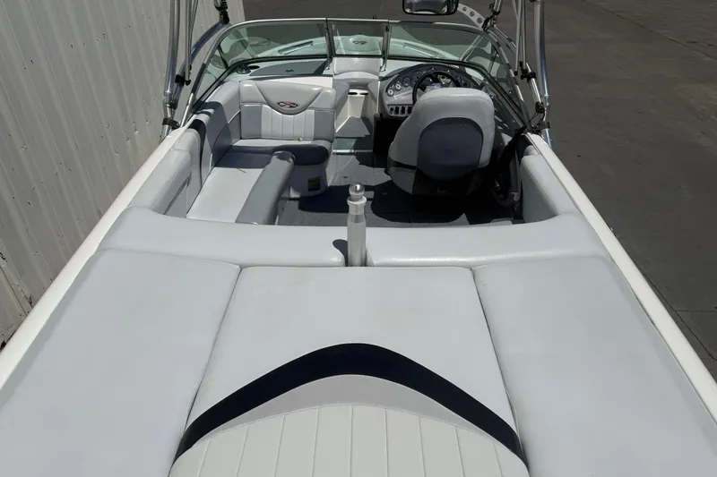 Slide: The Image of 2003 MasterCraft X2 boat interior with white seating and steering console. - 7
