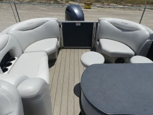 Slide: The Image of Interior of a 2016 Sylvan 8522 Cruise pontoon boat with gray seating. - 12