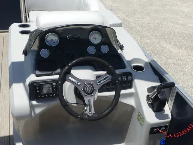Slide: The Image of Steering console of a 2016 Sylvan 8522 Cruise pontoon boat. - 16