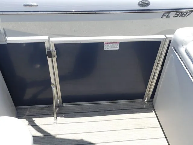 Slide: The Image of Sylvan 8522 Cruise 2016 boat door with wooden flooring. - 19