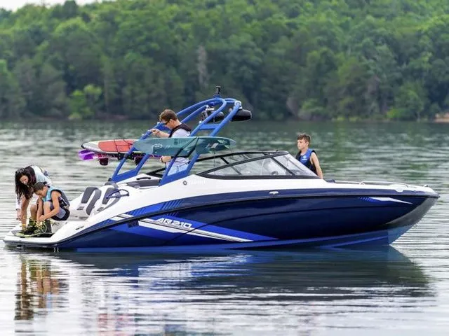 The Image of Yamaha AR210 2020 boat on a calm lake with passengers. - 1