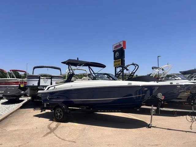 The Image of 2022 Bayliner VR4 Bowrider boat on trailer outdoors. - 1