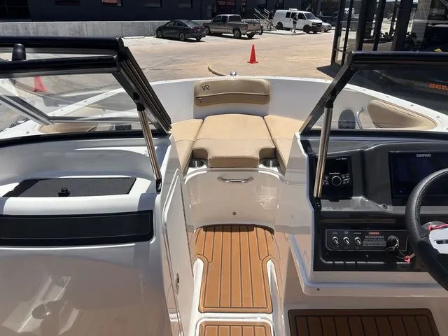 Slide: The Image of Interior view of a 2022 Bayliner VR4 Bowrider with wood flooring. - 10