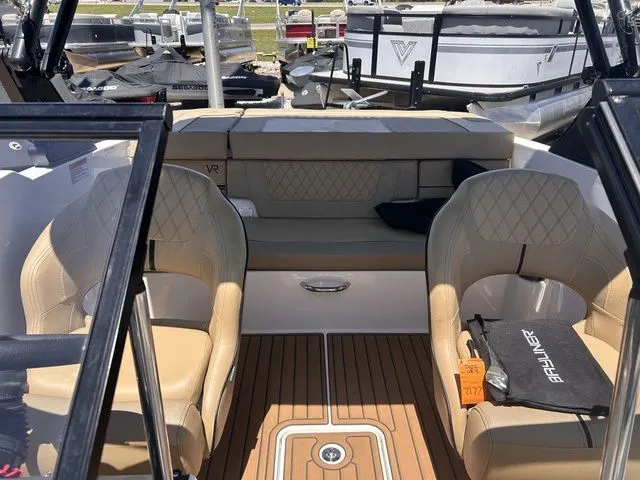 Slide: The Image of Interior of a 2022 Bayliner VR4 Bowrider with beige seats. - 14