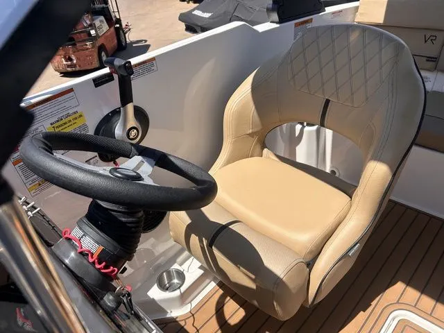 Slide: The Image of Interior of 2022 Bayliner VR4 Bowrider with steering wheel and seat. - 15
