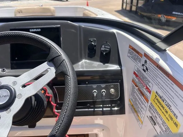 Slide: The Image of Dashboard of a 2022 Bayliner VR4 BOWRIDER with steering wheel and controls. - 19