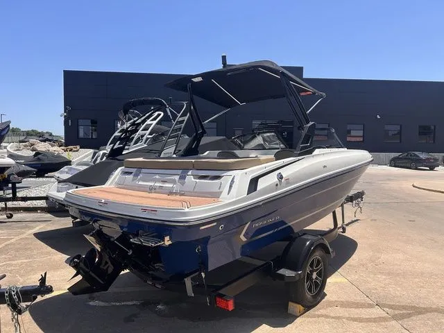 Slide: The Image of 2022 Bayliner VR4 Bowrider boat on a trailer outdoors. - 3