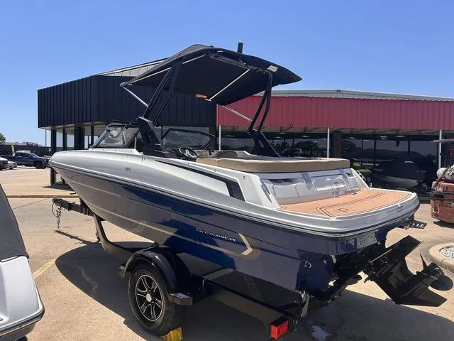 Slide: The Image of 2022 Bayliner VR4 Bowrider boat on trailer outdoors. - 5