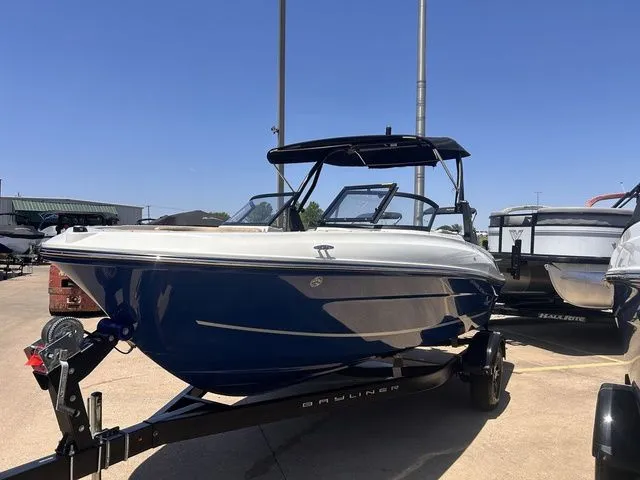 Slide: The Image of 2022 Bayliner VR4 Bowrider boat on trailer outdoors. - 7
