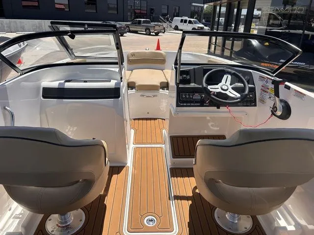 Slide: The Image of Interior view of 2022 Bayliner VR4 Bowrider with dual seats and wood-look flooring. - 9