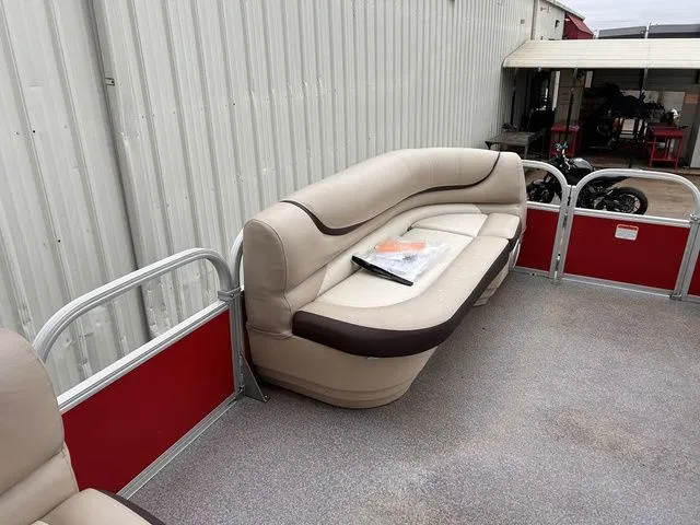 Slide: The Image of 2016 Sun Tracker Party Barge 20 DLX with beige seating area. - 17