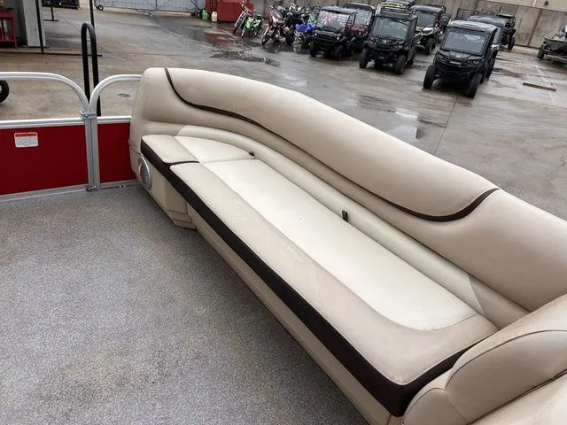 Slide: The Image of Interior of a 2016 Sun Tracker Party Barge 20 DLX with beige seating. - 18