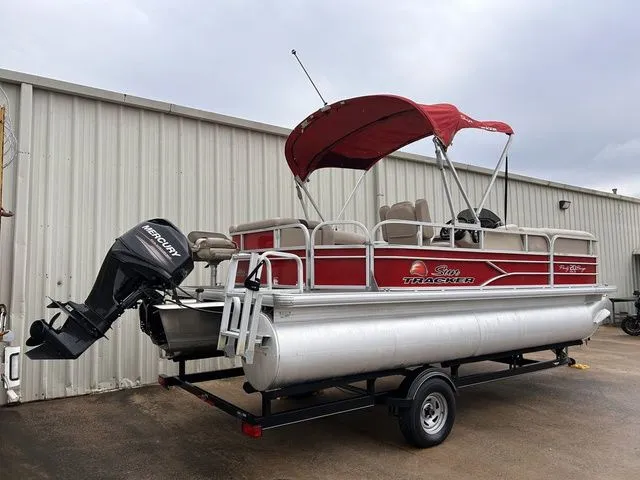 Slide: The Image of 2016 Sun Tracker Party Barge 20 DLX with red canopy and Mercury engine. - 3