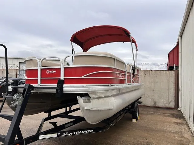Slide: The Image of 2016 Sun Tracker Party Barge 20 DLX pontoon boat with red canopy. - 7