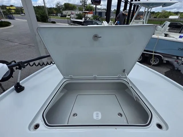 Slide: The Image of Open storage compartment on a 2025 Caymas 26 HB boat. - 11