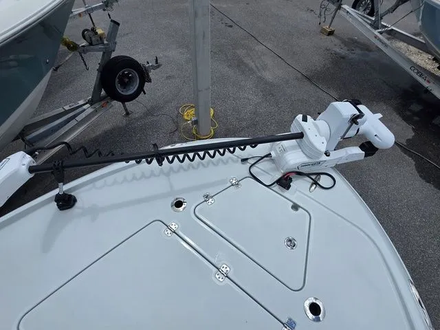 Slide: The Image of Caymas 26 HB 2025 with mounted trolling motor on deck. - 12