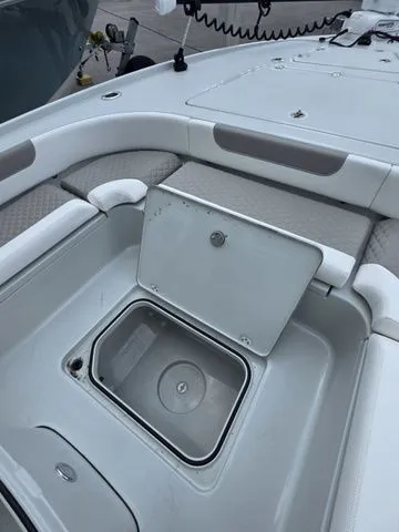 Slide: The Image of Caymas 26 HB 2025 boat with open storage compartment. - 15