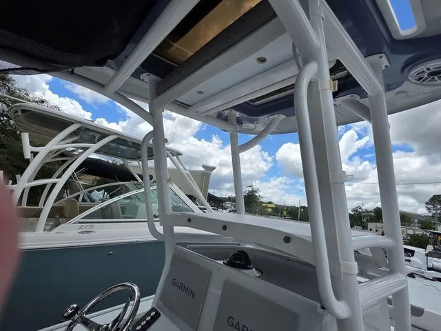 Slide: The Image of Caymas 26 HB 2025 boat with Garmin equipment, blue sky background. - 21