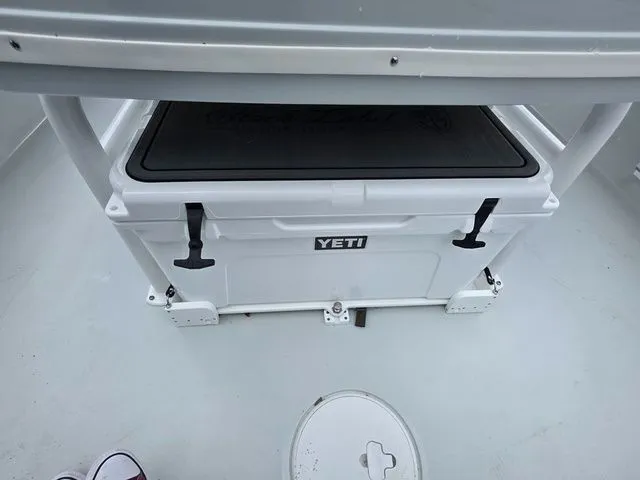 Slide: The Image of YETI cooler on Caymas 26 HB boat, model 2025. - 25
