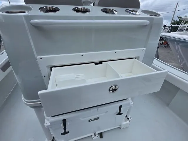Slide: The Image of Caymas 26 HB 2025 boat with storage drawer and cooler. - 26