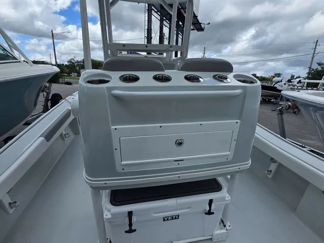 Slide: The Image of 2025 Caymas 26 HB boat interior with storage and cooler. - 27