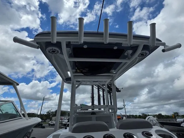 Slide: The Image of Caymas 26 HB 2025 boat with T-top and fishing rod holders. - 28