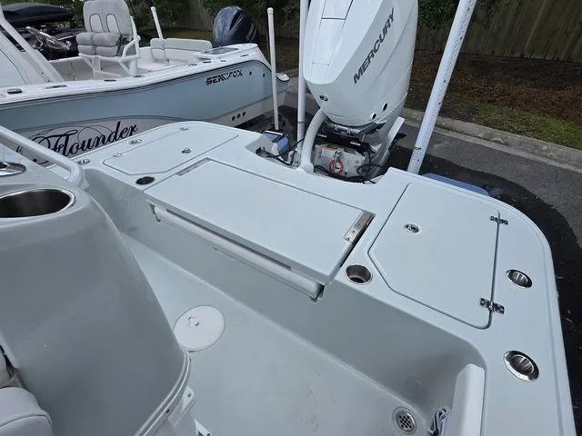 Slide: The Image of Caymas 26 HB 2025 boat with Mercury engine, spacious deck design. - 29