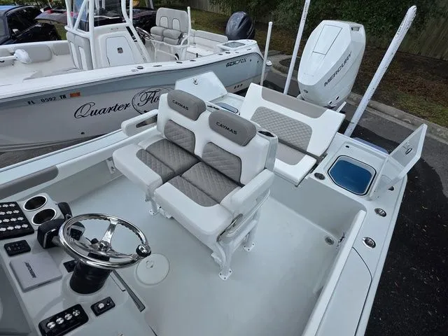 Slide: The Image of Interior of 2025 Caymas 26 HB with modern seating and controls. - 31