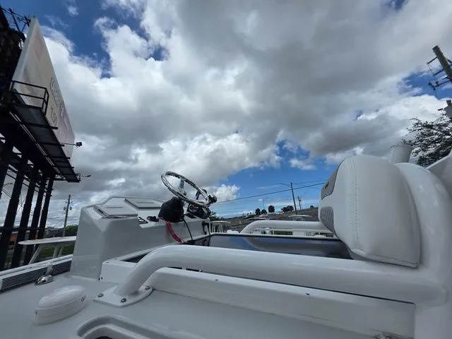 Slide: The Image of Caymas 26 HB 2025 boat with cloudy sky background. - 34