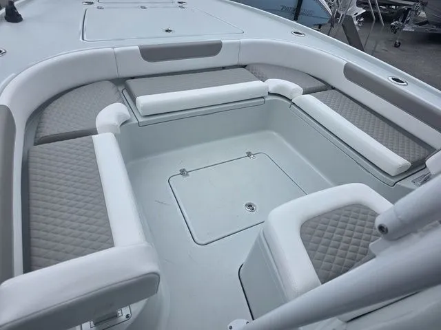 Slide: The Image of Interior of 2025 Caymas 26 HB with cushioned seating. - 35