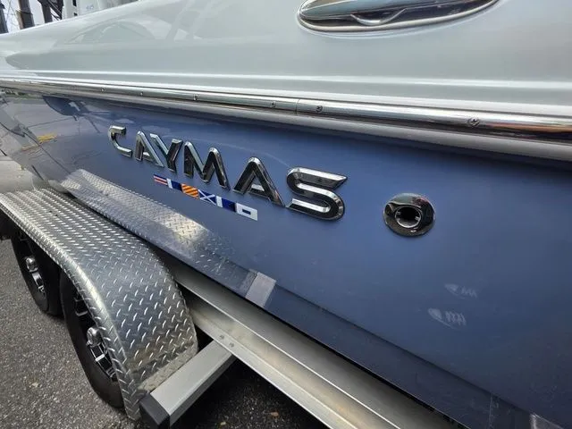 Slide: The Image of Close-up of Caymas 26 HB boat logo, model year 2025. - 5