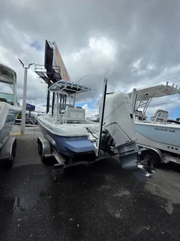 Slide: The Image of 2025 Caymas 26 HB boat on trailer under cloudy sky. - 6
