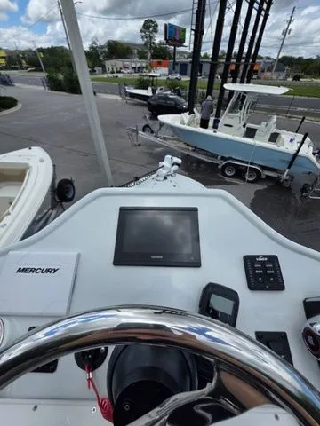 Slide: The Image of Dashboard of a 2025 Caymas 26 HB boat with electronics. - 8