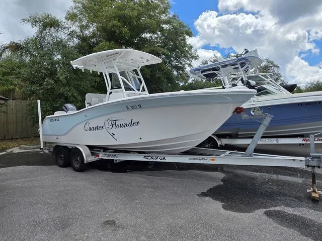 The Image of 2023 Sea Fox 228 Commander boat on trailer outdoors. - 1
