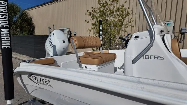 Slide: The Image of ALK2 Powerboats 18CRS 2026 model with brown seats outdoors. - 17