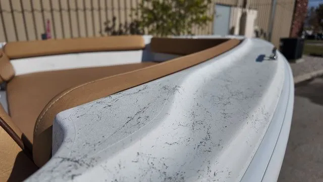 Slide: The Image of Close-up of 2026 ALK2 Powerboats 18CRS with brown seating. - 18