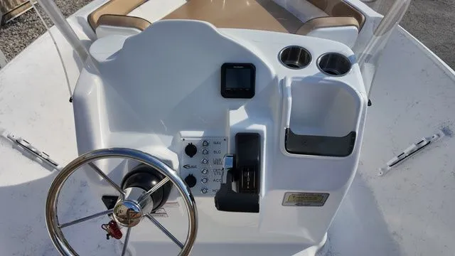 Slide: The Image of ALK2 Powerboats 18CRS 2026 helm with steering wheel and controls. - 27