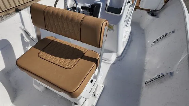 Slide: The Image of Interior of 2026 ALK2 Powerboats 18CRS with brown seating. - 29