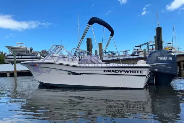 Slide: The Image of 2008 Grady-White 185 boat docked with Yamaha outboard motor. - 8