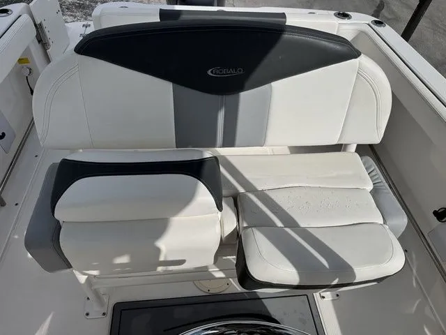 Slide: The Image of 2022 Robalo R222 Explorer seating area with white and black upholstery. - 12