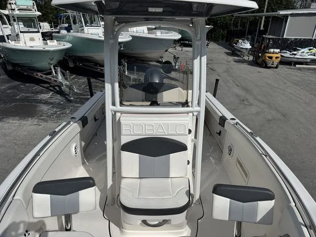 Slide: The Image of 2022 Robalo R222 Explorer boat with seating area and helm. - 22