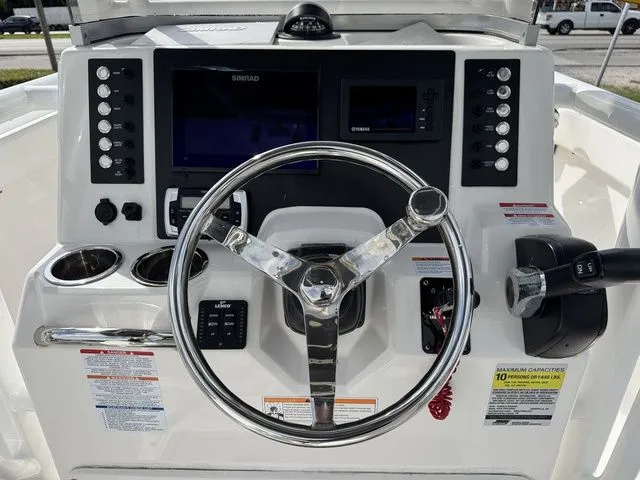 Slide: The Image of 2022 Robalo R222 Explorer helm with modern controls and displays. - 9