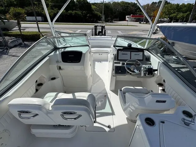 Slide: The Image of Interior view of a 2012 Robalo 247 DC boat with helm console. - 10