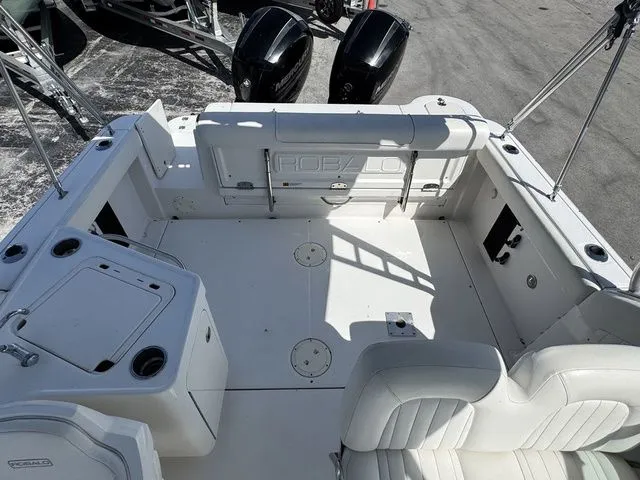 Slide: The Image of Interior of a 2012 Robalo 247 DC boat with white seating. - 18
