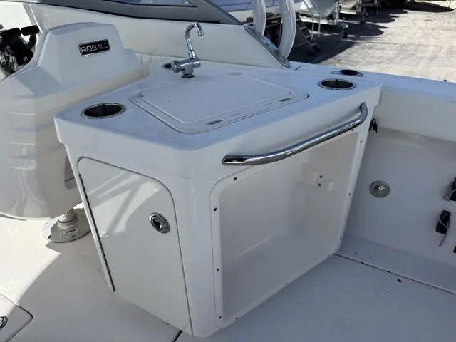 Slide: The Image of Robalo 247 DC 2012 boat kitchenette with sink and storage. - 21