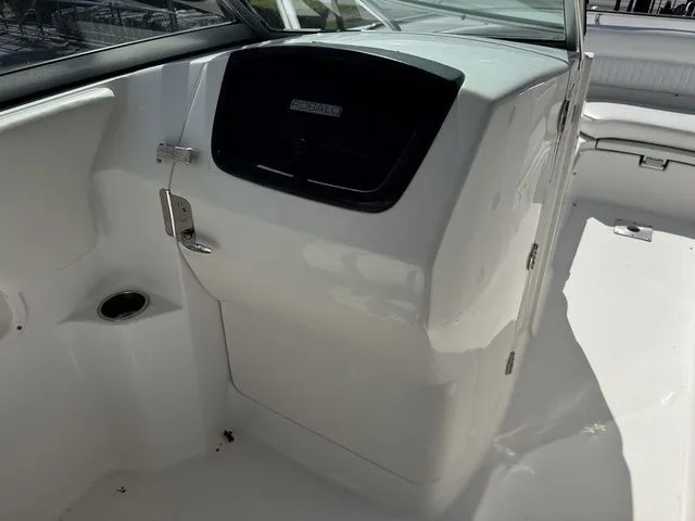Slide: The Image of Interior view of a 2012 Robalo 247 DC boat, white cabin. - 23