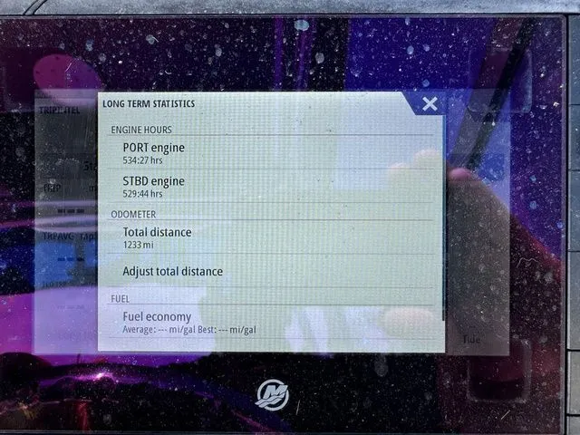 Slide: The Image of Boat statistics on screen, Robalo 247 DC 2012, engine hours and mileage. - 26
