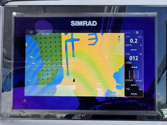 Slide: The Image of Simrad navigation system on a 2012 Robalo 247 DC boat. - 27